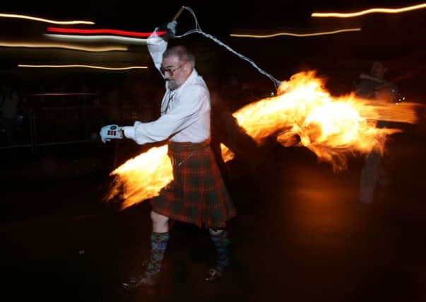 Number 33: Seeing the Hogmanay fireball swingers illuminate the streets of Stonehaven, carrying on the tradition of welcoming the new year. Picture: Getty