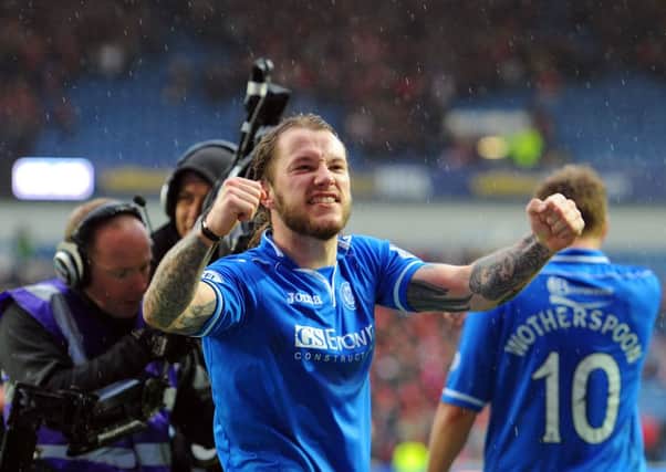 A delighted Stevie May salutes the fans after his 2 goals won the match for Saints.  Picture: Robert Perry