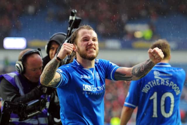 A delighted Stevie May salutes the fans after his 2 goals won the match for Saints. Picture: Robert Perry