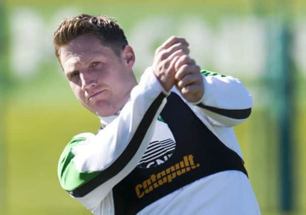 Player of the year nominee Kris Commons practises his golf swing in training yesterday. Picture: SNS