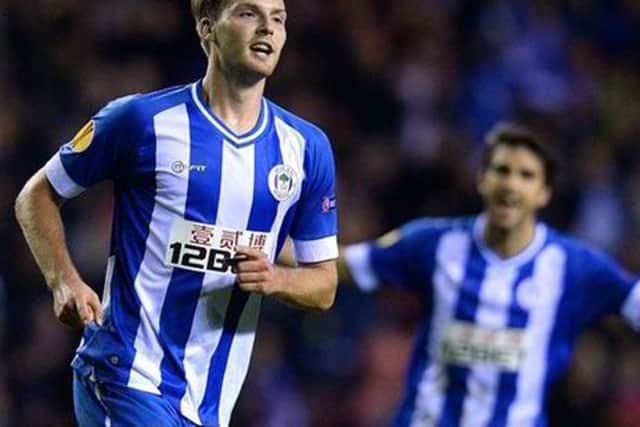 Nick Powell celebrates scoring for Wigan. Picture: Getty