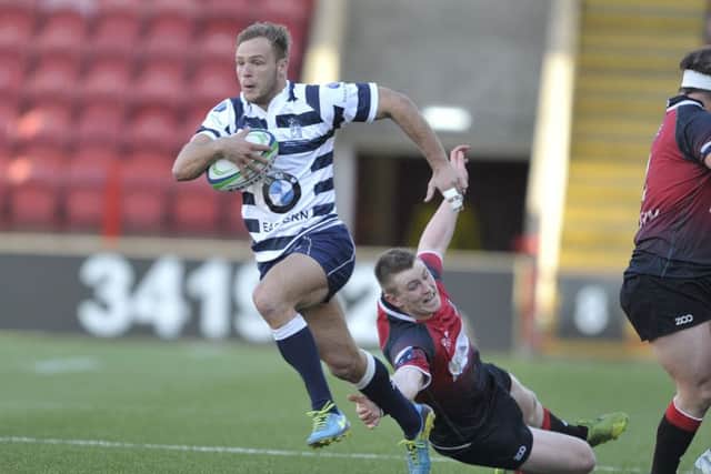 Harry Boisseau streaks away to score the most spectacular try of Heriots RBS Cup final win. Picture: Ian Rutherford