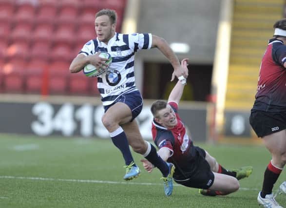 Harry Boisseau streaks away to score the most spectacular try of Heriots RBS Cup final win. Picture: Ian Rutherford