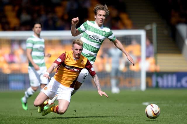 Motherwell defender Craig Reid is taken down by Stafen Johansen. Picture: SNS
