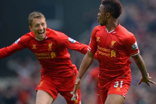 Raheem Sterling prepares to take the acclaim of teammate Lucas Leiva after scoring Liverpools opener. Picture: Getty