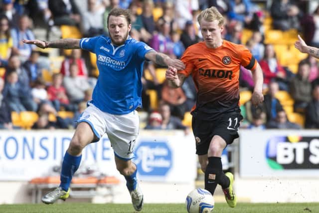 Stevie May tracks back to challenge Uniteds Gary Mackay-Steven. Picture: SNS