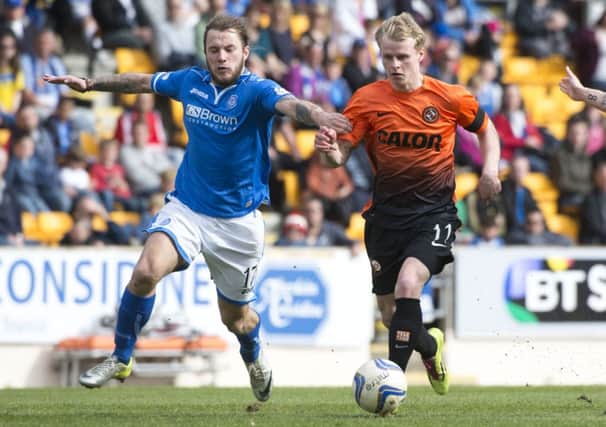 Stevie May tracks back to challenge Uniteds Gary Mackay-Steven. Picture: SNS