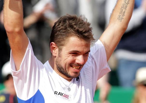 Stanislas Wawrinka shows his delight at beating Roger Federer in Monte Carlo yesterday. Picture: Getty