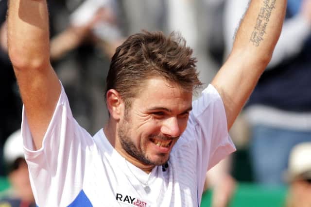 Stanislas Wawrinka shows his delight at beating Roger Federer in Monte Carlo yesterday. Picture: Getty