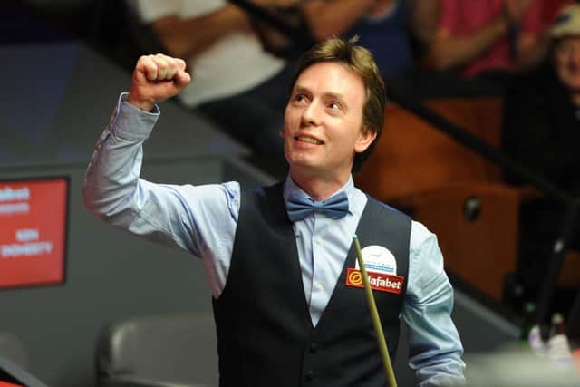 Ken Doherty celebrates victory in his first round match against Stuart Bingham. Picture: PA