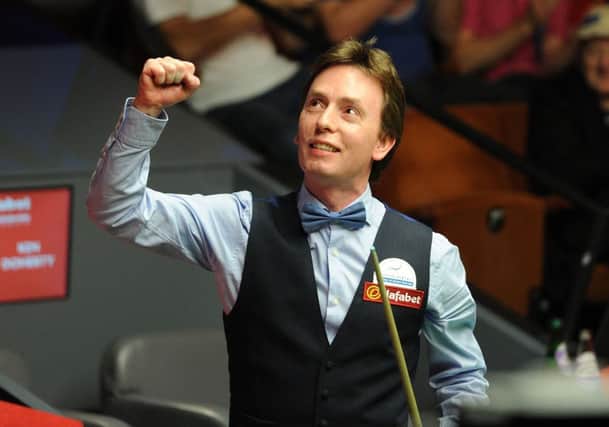 Ken Doherty celebrates victory in his first round match against Stuart Bingham. Picture: PA