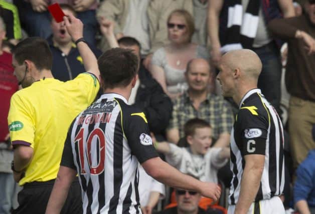 Jim Goodwin (right) looks stunned as referee Kevin Clancy flashes the red card. Picture: PA