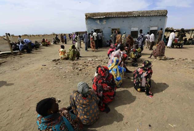 People fleeing an attack on a South Sudanese town wait to register after arriving in Joda, on the border with Sudan. Picture: Reuters
