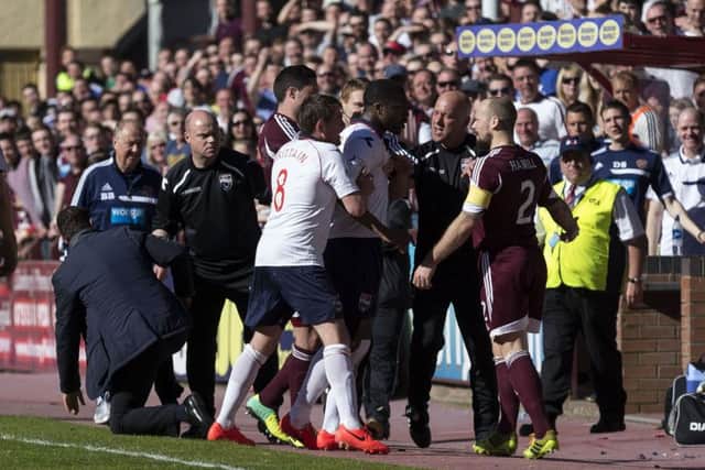 Jamie Hamill (right) is involved in an incident with County manager Derek Adams. Picture: SNS