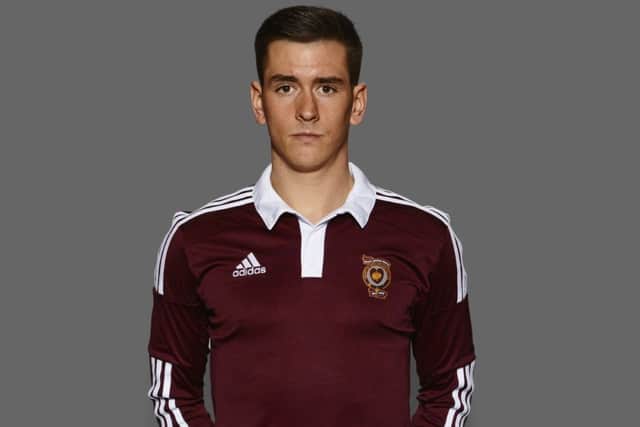 Jamie Walker models the new Hearts home shirt, a tribute to the team of 1914. Picture: Contributed