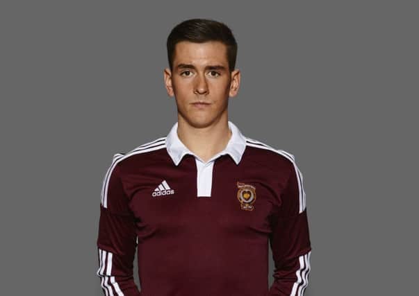 Jamie Walker models the new Hearts home shirt, a tribute to the team of 1914. Picture: Contributed