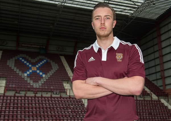 Danny Wilson models the new Hearts kit at Tynecastle. Picture: SNS