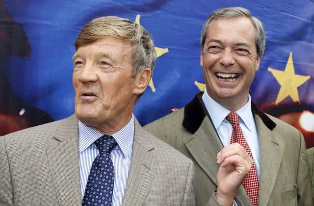 Ukip leader Nigel Farage speaks to Paul Sykes at the launch of his party's European election bilboard campaign. Picture: PA