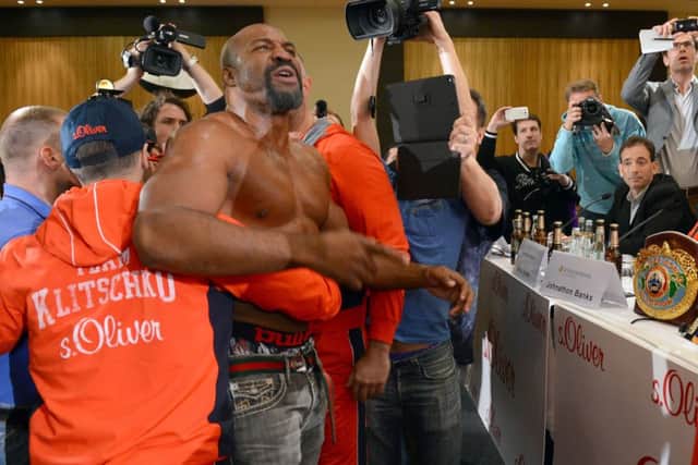 Shannon Briggs is held back by security after he challenged Wladimir Klitschko to a fight. Picture: Getty