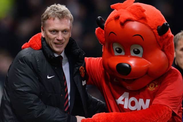 David Moyes, seen here with club mascot Fred the Red, was sacked yesterday. Picture: AFP