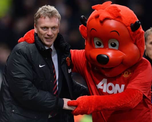 David Moyes, seen here with club mascot Fred the Red, was sacked yesterday. Picture: AFP