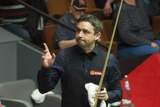 Alan McManus acknowledges the audience as he leaves the arena following his victory. Picture: PA