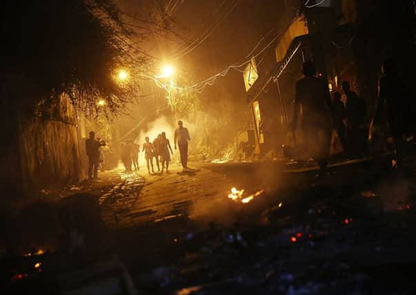 Copacabana was set ablaze by angry residents after a local mans body was found. Picture: Getty