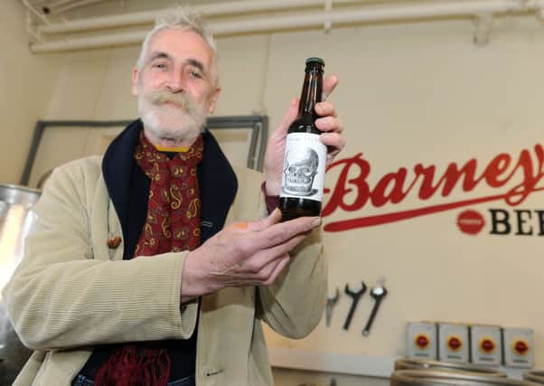 John Byrne with an example of his Extra Pale limited edition label. Picture: Lisa Ferguson