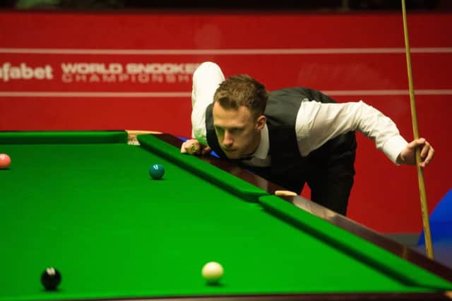 Judd Trump contemplates a tricky shot during his 108 firstround win over qualifier Tom Ford. Picture: Getty