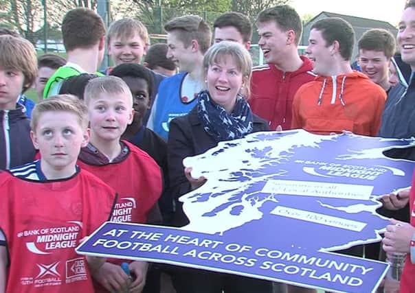 Shona Robison meets children taking part in a five-a-side football initiative in Dundee. Picture: SNS/Material