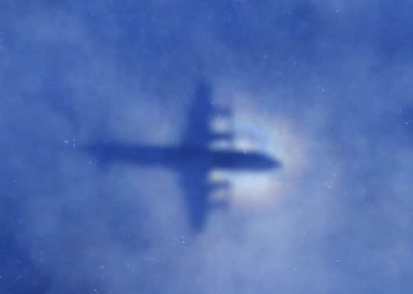 A Royal New Zealand Air Force plane searches for missing Malaysia Airlines Flight MH370 in March. Picture: AP