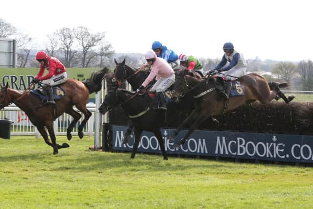 Majala (No 6) and Alain Cawley at the last before winning the Festival Handicap Chase. Picture: John Grossick