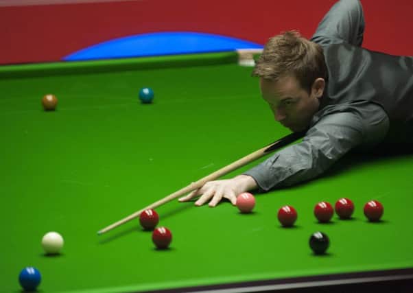 Ali Carter in action against Mark Selby during the Dafabet World Snooker Championships at The Crucible, Sheffield.Picture: PA