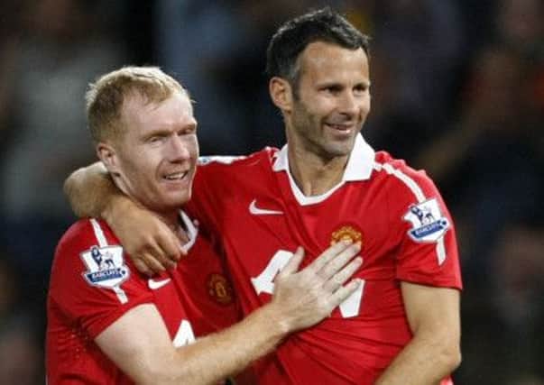Re-united once more, Ryan Giggs promises that he and Paul Scholes will bring the passion back to the Manchester United dressing room. Picture: AP