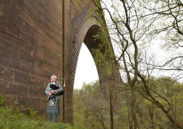 Piper Willie Gilmour plays at a ceremony commemorating the refurbishment of the Ballochmyle Viaduct. Picture: David Gordon