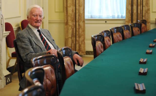 Bomber Command pilot Leslie Valentine sits in the Prime Minister's chair in the cabinet room in Downing Street, he met the Prime Minister David Cameron who presented him with a Defence medal for services in the second world war.