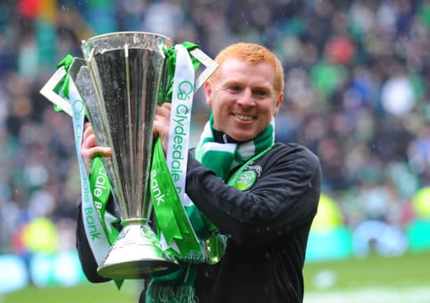 Celtic manager Neil Lennon celebrates winning last year's league title. Picture: Robert Perry