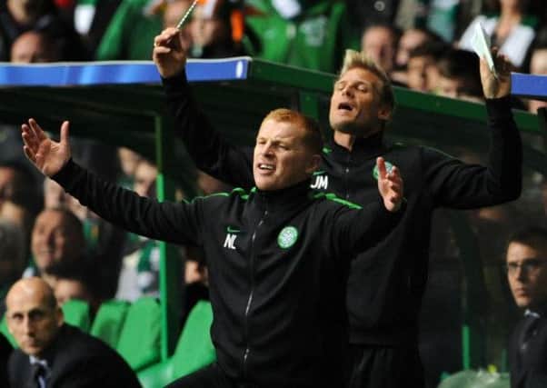 Celtic Manager Neil Lennon with assistant coach Johan Mjallby behind. Picture: Ian Rutherford