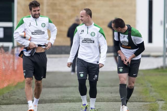 Celtic's Charlie Mulgrew, Leigh Griffiths and Scott Brown head down to training at Lennoxtown yesterday. Picture: SNS