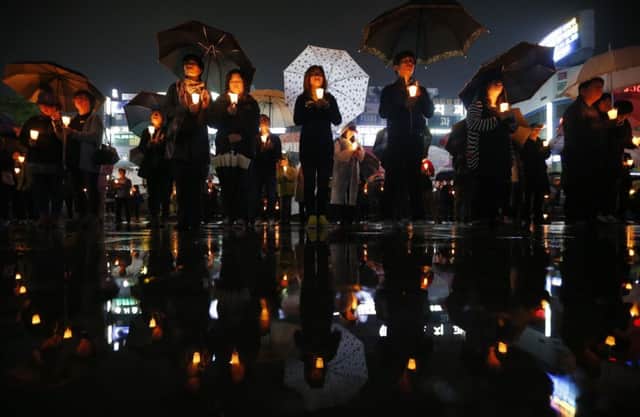 A candlelit vigil was held yesterday in Ansan for the victims of the ferry disaster. Picture: Reuters