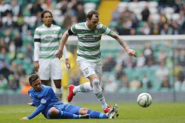 Celtic's Anthony Stokes takes on Inverness' Danny Williams. Picture: PA