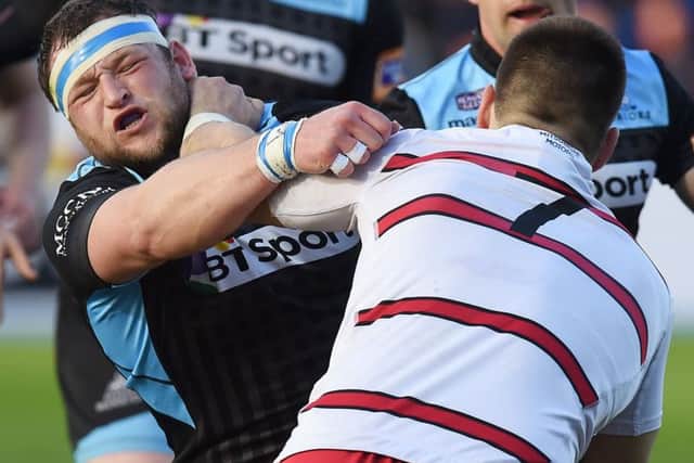 Edinburgh back row Cornell du Preez tries to burrow his way past Glasgow prop Ryan Grant. Picture: SNS/SRU