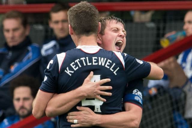 Richard Brittain shows his delight and relief as he embraces Stuart Kettlewell after scoring Countys second goal. Picture: SNS