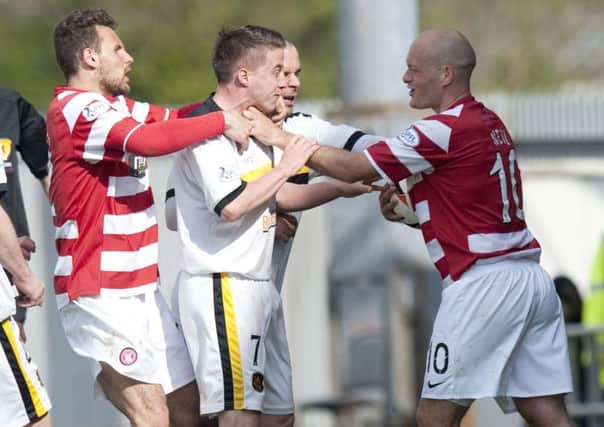 Hamilton player/manager Alex Neil, right, was sent off for this bust-up with Dumbarton player Mark Gilhaney. Picture: SNS