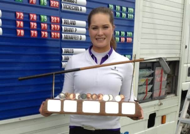 Annabel Dimmock with her trophy after winning by three