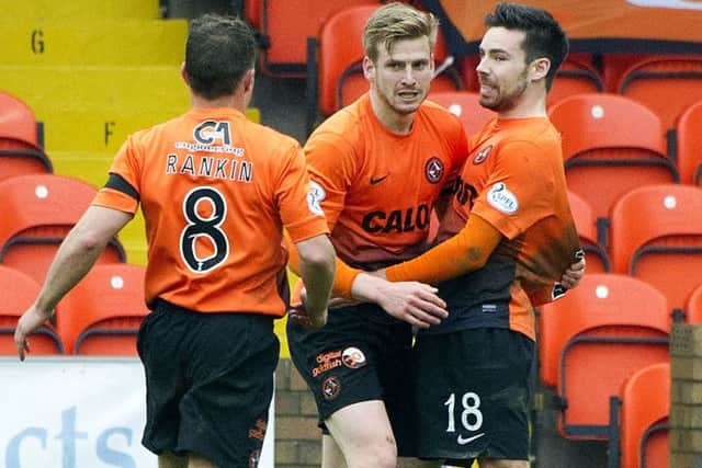 Dundee United's Stuart Armstrong (centre) celebrates his SPFL Award-winning strike. Picture: SNS