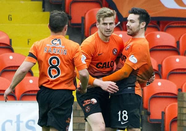 Dundee United's Stuart Armstrong (centre) celebrates his SPFL Award-winning strike. Picture: SNS