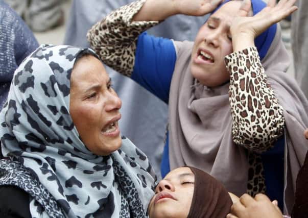 Female relatives outside the court wept on hearing the sentence. Picture: Reuters
