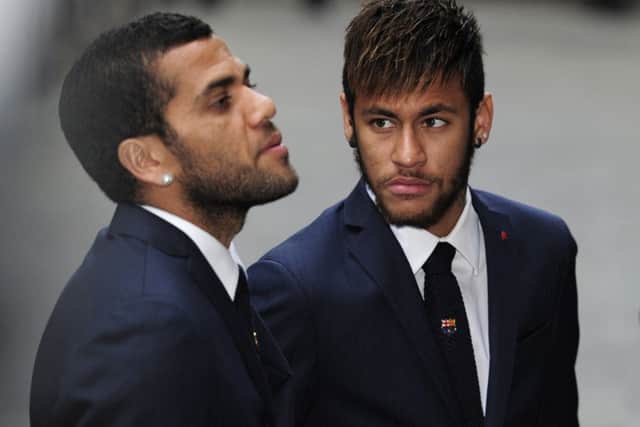 Dani Alves, left, and Neymar attend a memorial service for Tito Vilanova. Picture: Getty