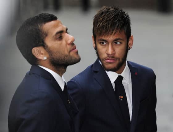 Dani Alves, left, and Neymar attend a memorial service for Tito Vilanova. Picture: Getty
